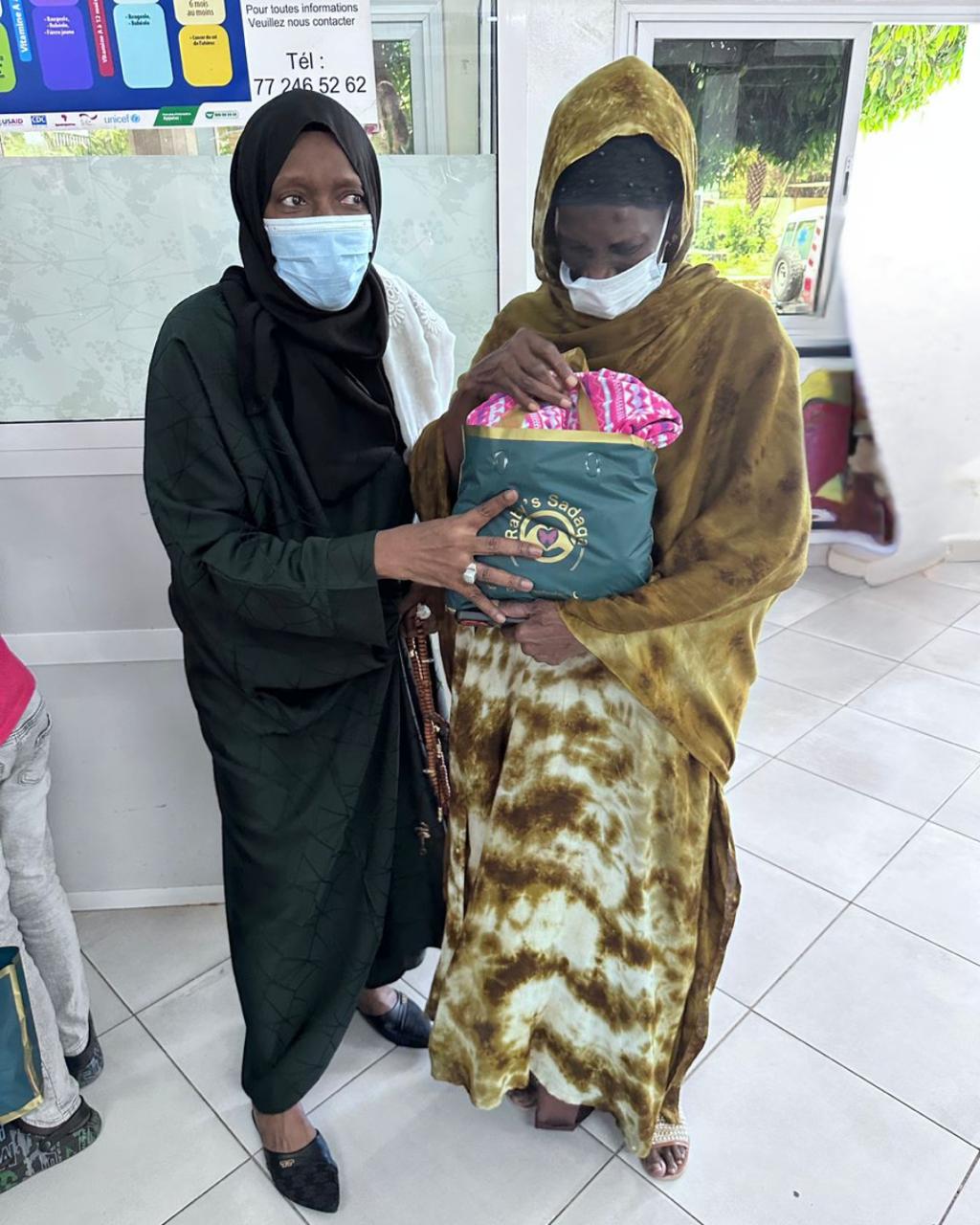 Hospital visit with donations for a baby's parent